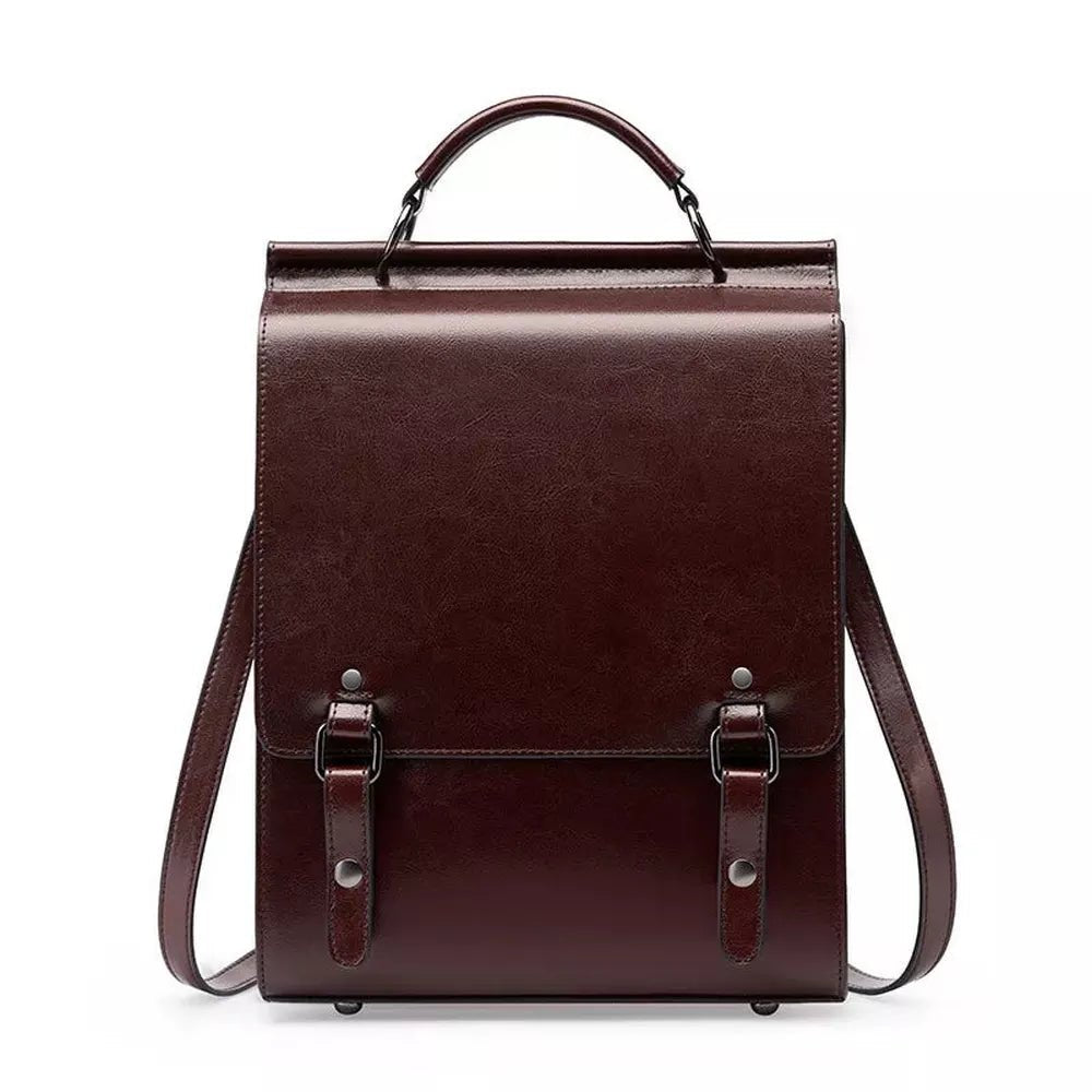 Sac à dos vintage en cuir marron foncé avec poignée supérieure et boucles avant