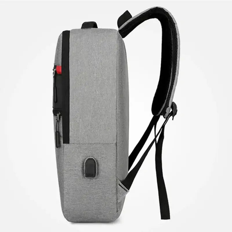 Sac à dos avec poche ordinateur gris et accents noirs, port de charge USB intégré