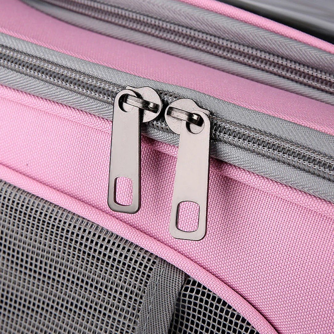Deux tirettes de fermeture éclair argentées sur tissu rose et gris pour Sac à dos Chat Transparent Chatelair