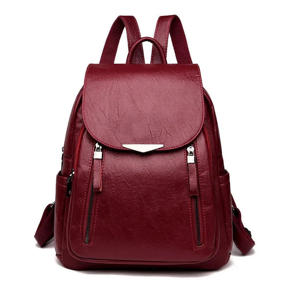 Sac à dos cuir souple en faux cuir marron avec hardware argenté et multiples poches zippées