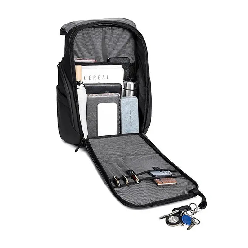 Sac à dos de travail femme noir ouvert avec compartiments et articles à l’intérieur