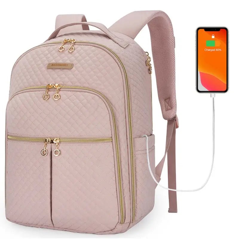 Sac à dos en tissus femme rose quilté avec zippers dorés et port de chargement USB