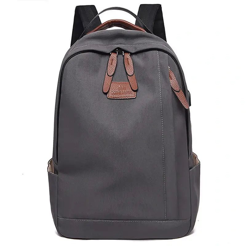 Sac à dos garçon d’école classique gris foncé avec accents en cuir marron et multiples poches
