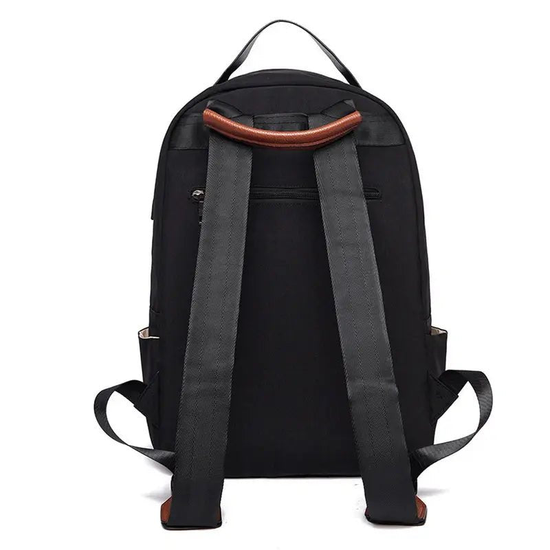Sac à dos noir pour garçon avec poignée en cuir marron et bretelles ajustables