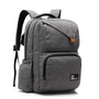 Cartable noir d école en tissu gris avec plusieurs compartiments et accents en cuir marron