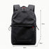 Sac à dos en nylon noir avec accents de fermeture éclair rouges et poches latérales à cordon pour ados et collégiens