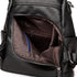 Sac à dos en cuir noir pour femme avec poche frontale zippée et pochette bleue intérieure