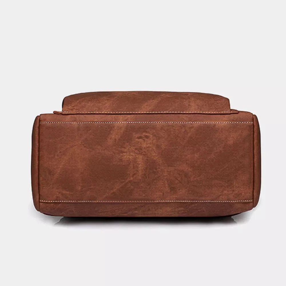 Sac à dos en cuir vintage brun distressed avec coutures blanches