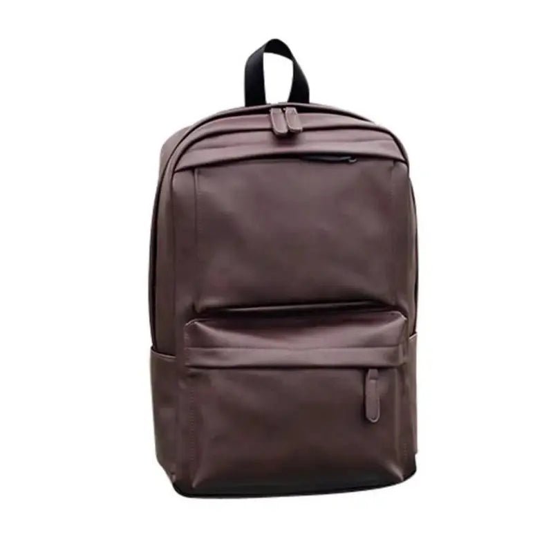 Sac à dos en cuir marron avec poignée supérieure et poches frontales