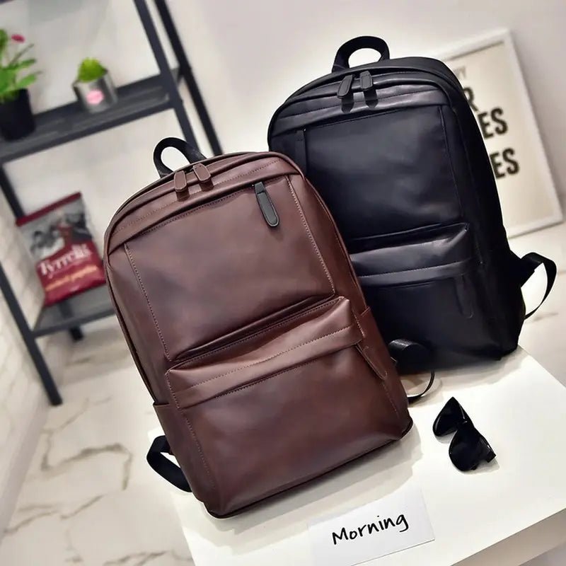 Grand sac à dos en cuir en faux cuir noir et marron avec poche zippée et poignée supérieure