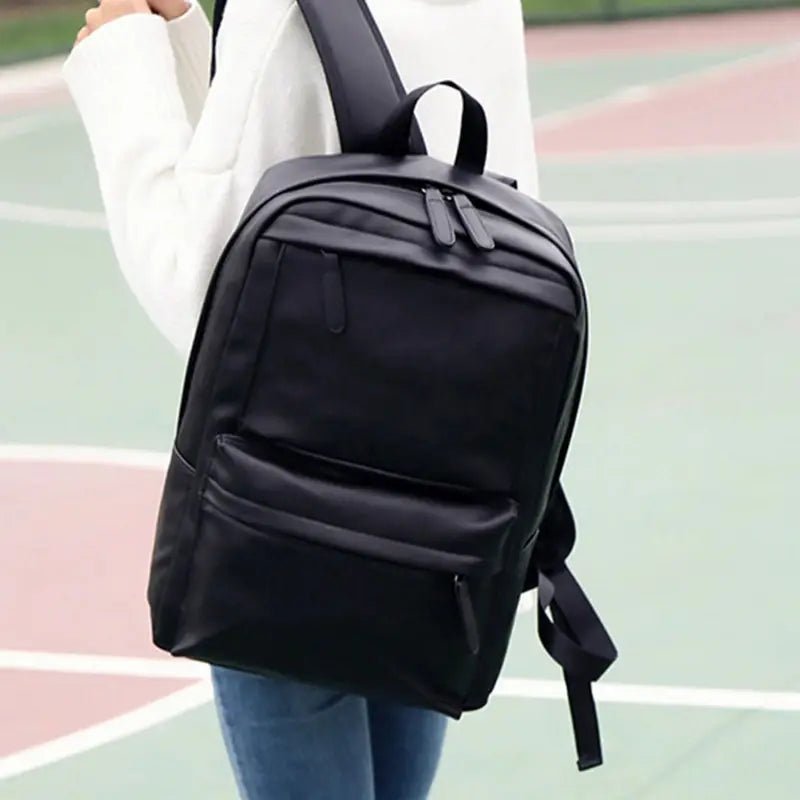 Sac à dos en cuir synthétique noir avec plusieurs compartiments zippés pour femmes