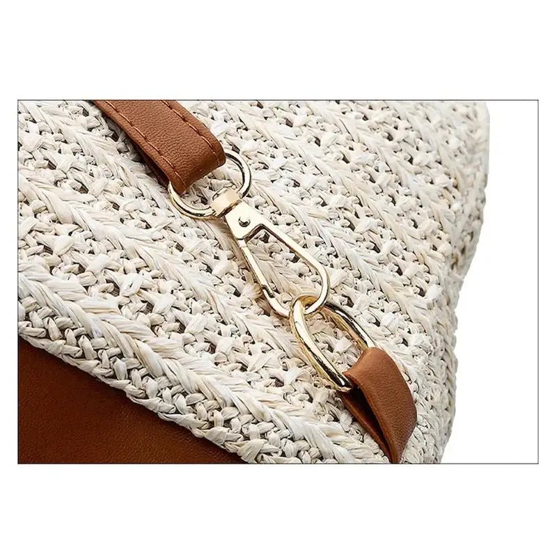 Sac à dos femme de plage en paille avec bandoulière en cuir marron et quincaillerie dorée