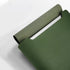 Étui en cuir vert pour PC avec intérieur en tissu texturé, pochette de protection élégante