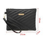 Pochette femme en cuir noire matelassée avec dragonne et accessoires en or