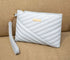 Pochette femme en cuir bleu clair avec quilting, poignée et fermeture éclair dorée