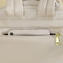 Sac à dos Amber en cuir crème avec fermeture éclair or et poignée élégante