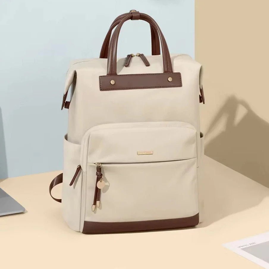 Sac à dos beige femme avec accents en cuir marron et poignée supérieure