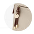 Sac à dos beige femme avec pompon en cuir marron et disque en or