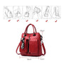 Sac à dos carré cuir rouge en faux cuir convertible avec poches et tassel décoratif