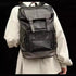 Sac à dos en cuir noir homme décontracté avec fermetures à boucle et poches multiples