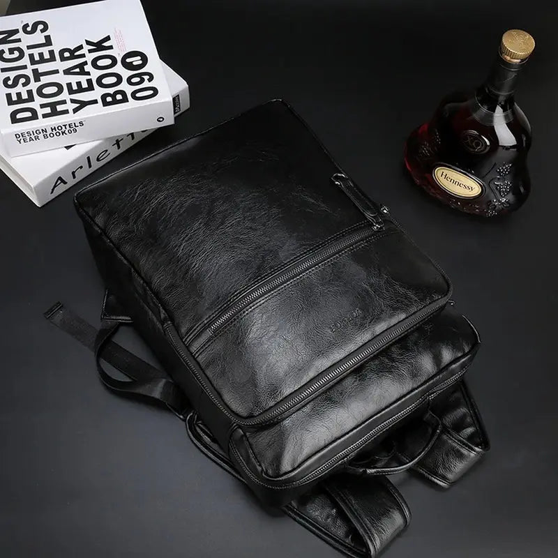 Sac à dos cuir homme en faux cuir noir avec poches zippées et bretelles ajustables