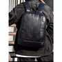 Sac à dos cuir homme ordinateur en faux cuir noir avec poche zippée verticale frontale