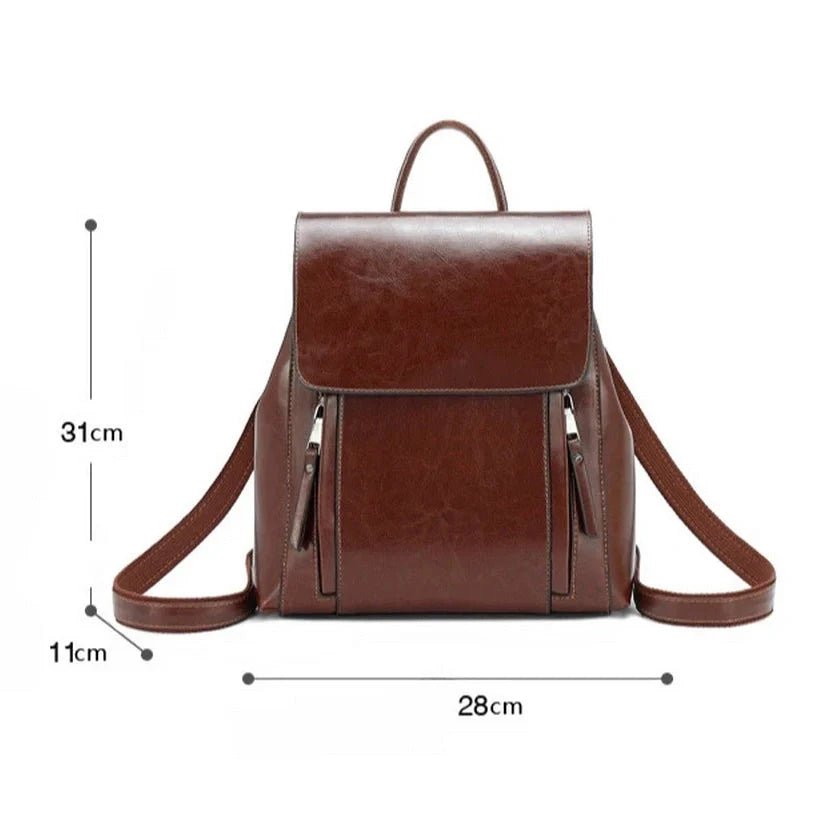 Sac à dos en cuir marron foncé brillant avec poignée supérieure et poches zippées