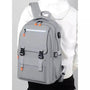 Sac à dos de cours gris avec accents orange, multiples compartiments et port USB