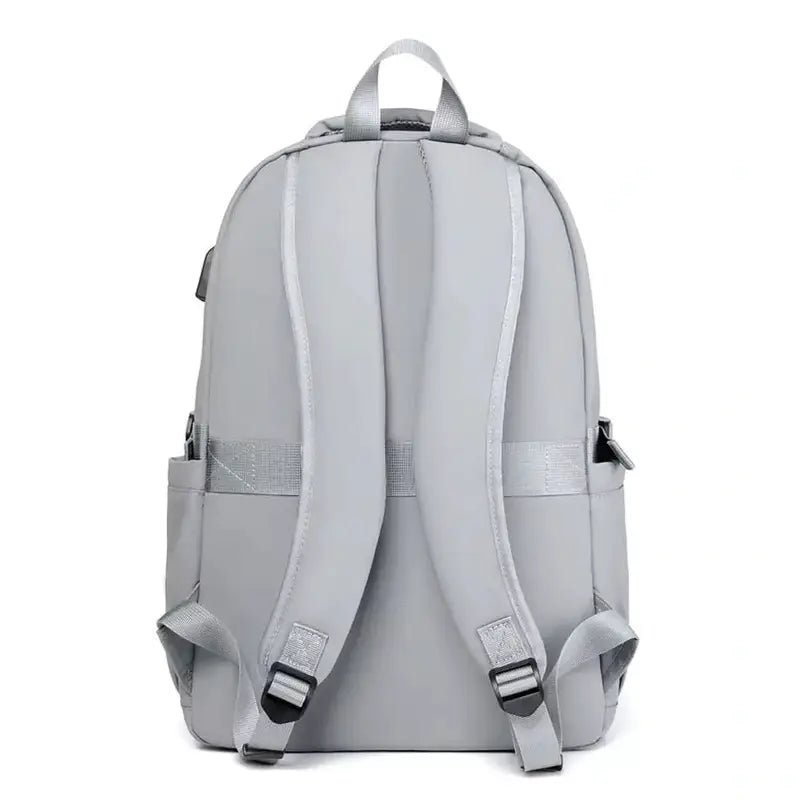 Sac à dos de cours gris clair avec bretelles ajustables et poignée supérieure
