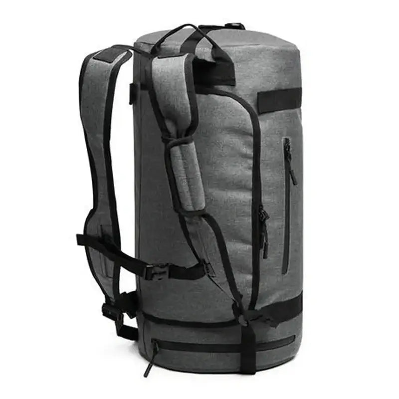 Sac à dos de sport gris en cylindre avec poches zippées et bretelles rembourrées