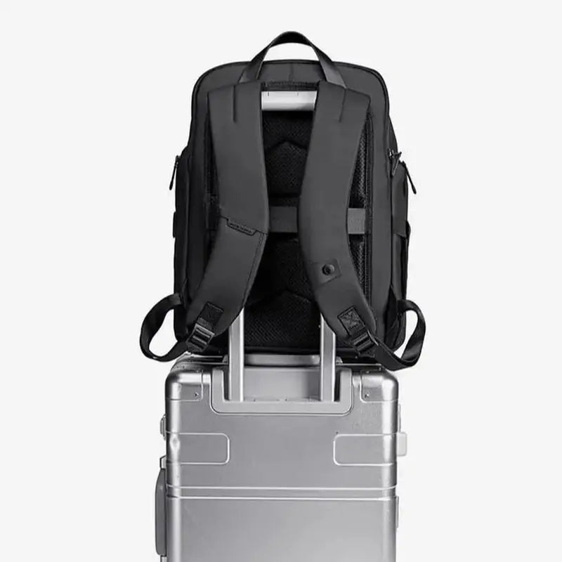 Sac à dos de travail femme noir avec bretelles rembourrées pour valise à roulettes argentée