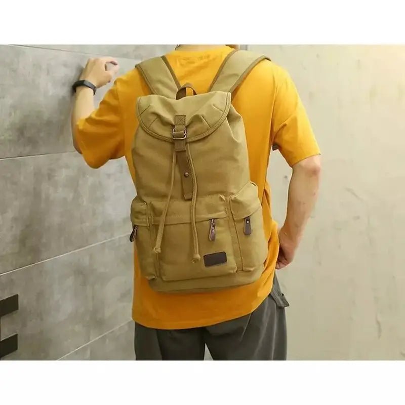 Sac à dos de voyage en toile kaki avec cordon de serrage, boucle et poches frontales