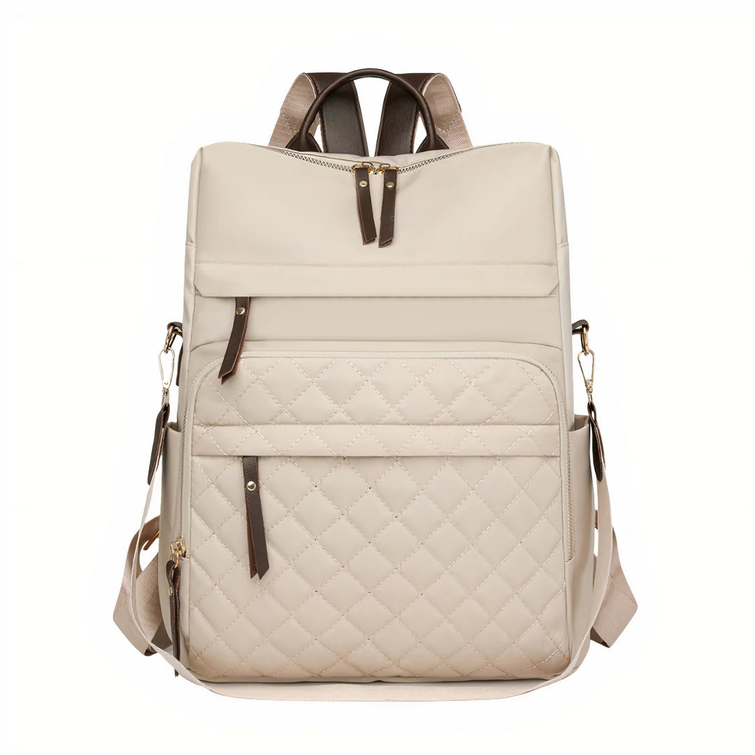 Sac à dos effet matelassé beige avec accents en cuir marron et bretelles ajustables