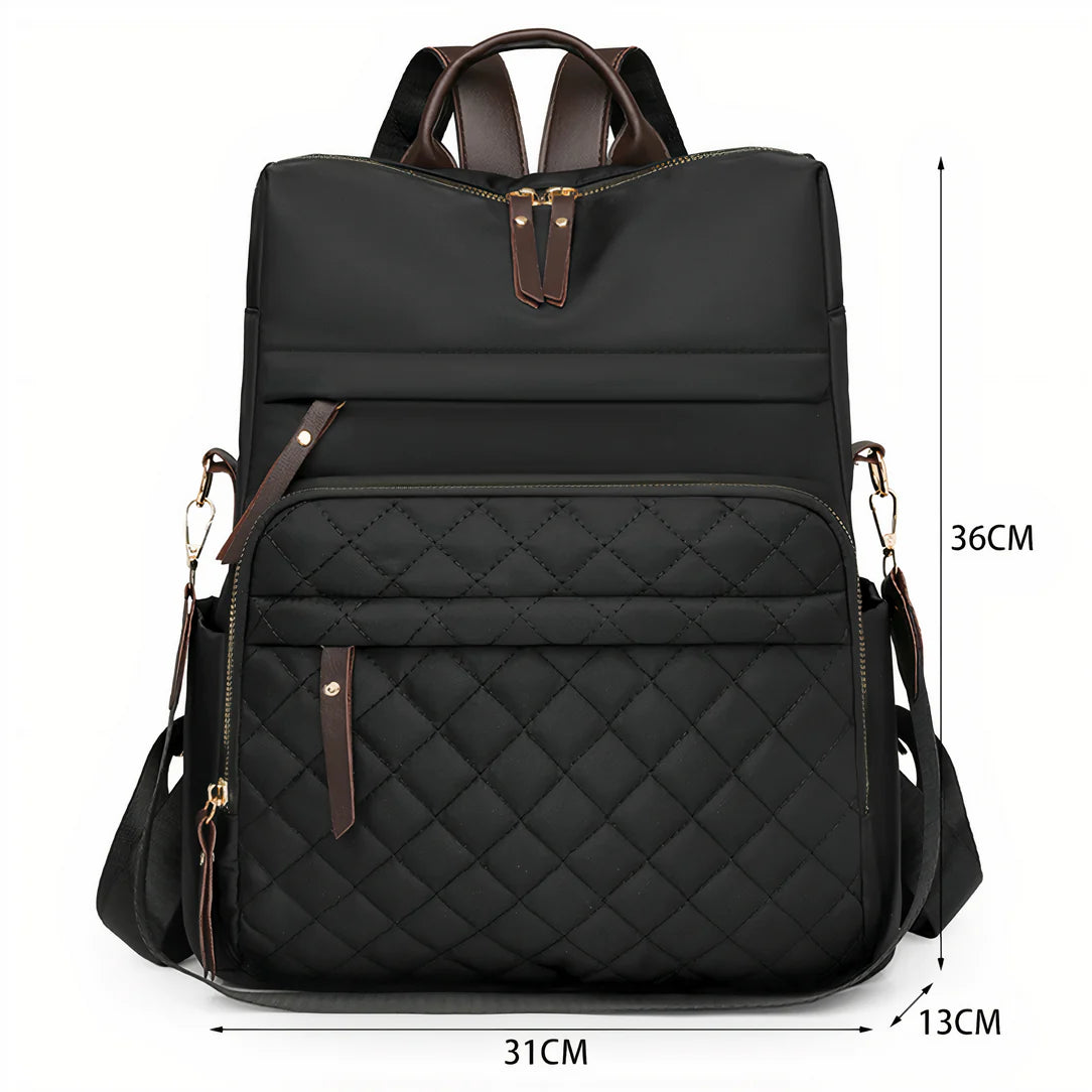 Sac à dos effet matelassée Céleste avec noir quilté, accents marron et bretelles ajustables