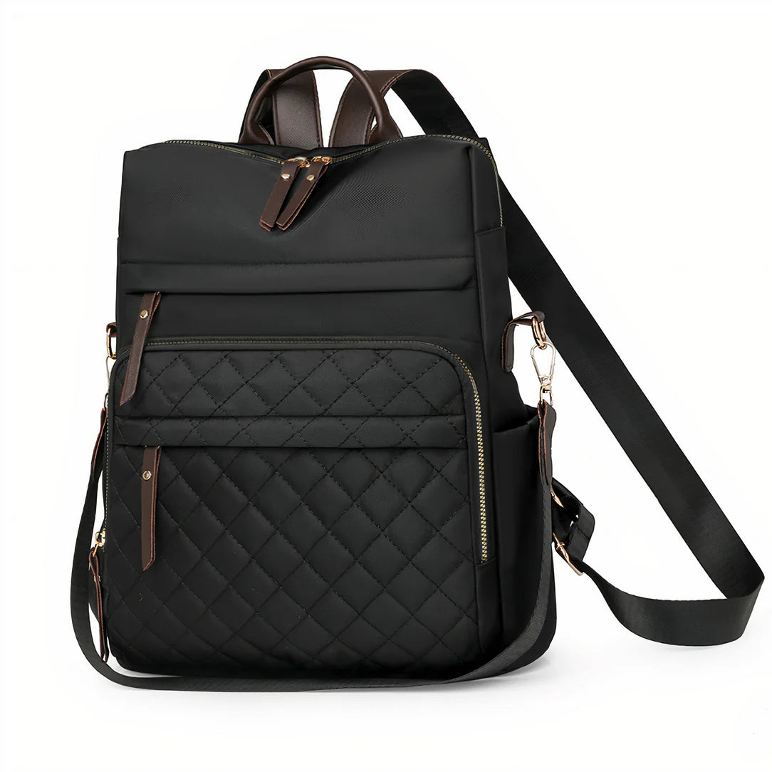 Sac à dos effet matelassée Céleste noir avec accents en cuir marron et bandoulière ajustable