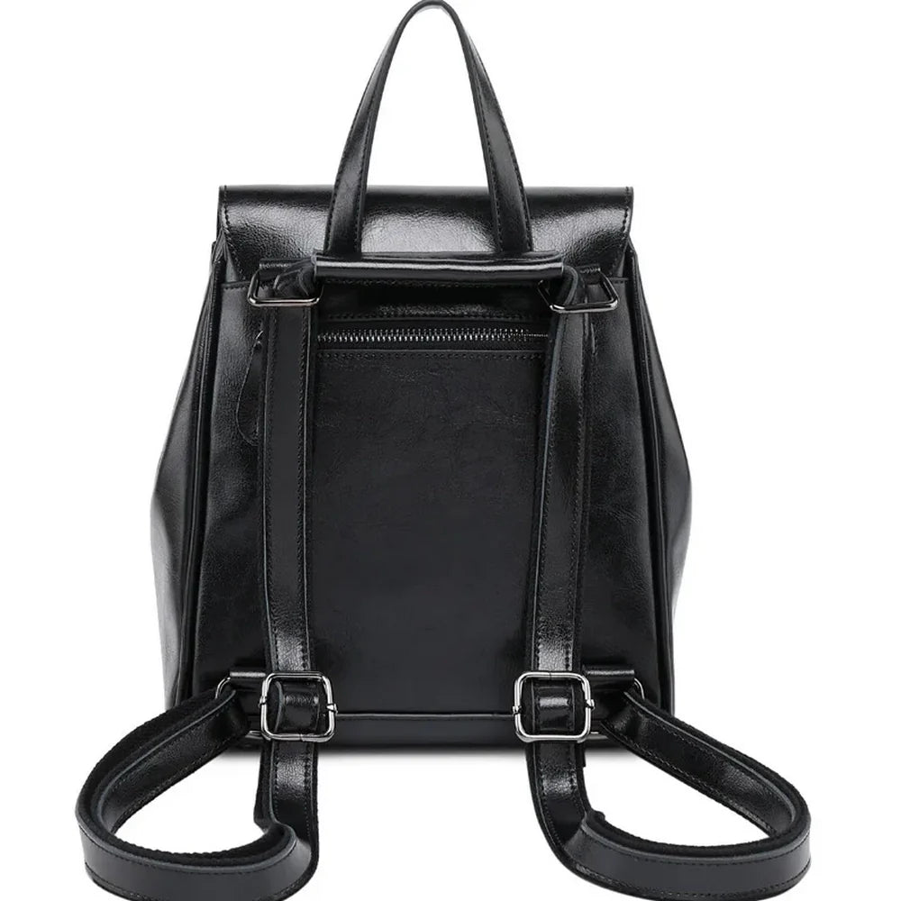 Sac à dos en cuir de vachette en cuir verni noir avec poignées et bretelles ajustables