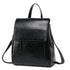 Sac à dos en cuir de vachette noir avec rabat, bandoulière ajustable et poche zippée