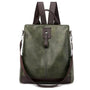 Sac à dos en cuir femme tendance en vert foncé avec bretelles marron et fermeture verticale