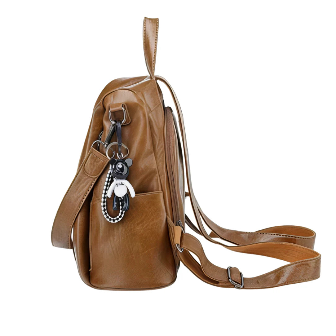 Sac à dos en cuir tan avec sangles ajustables, poche avant et porte-clés noir et blanc