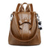 Sac à dos en cuir marron avec nœud papillon, accent bow et charm ours