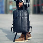 Sac à dos en cuir noir pour homme avec poignée supérieure et poche zippée frontale