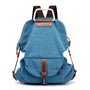 Sac à dos en tissu minimaliste bleu avec accents en cuir marron et poignée en métal argenté
