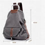 Sac à dos en tissu minimaliste gris en toile avec accents en cuir marron et ferrures argentées