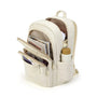 Sac à dos en tissu multi-compartiments beige avec livres et bouteille d’eau