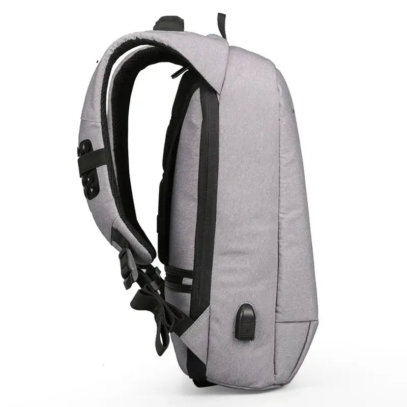 Sac à dos ergonomique gris clair avec accents noirs, sangle rembourrée et port USB externe