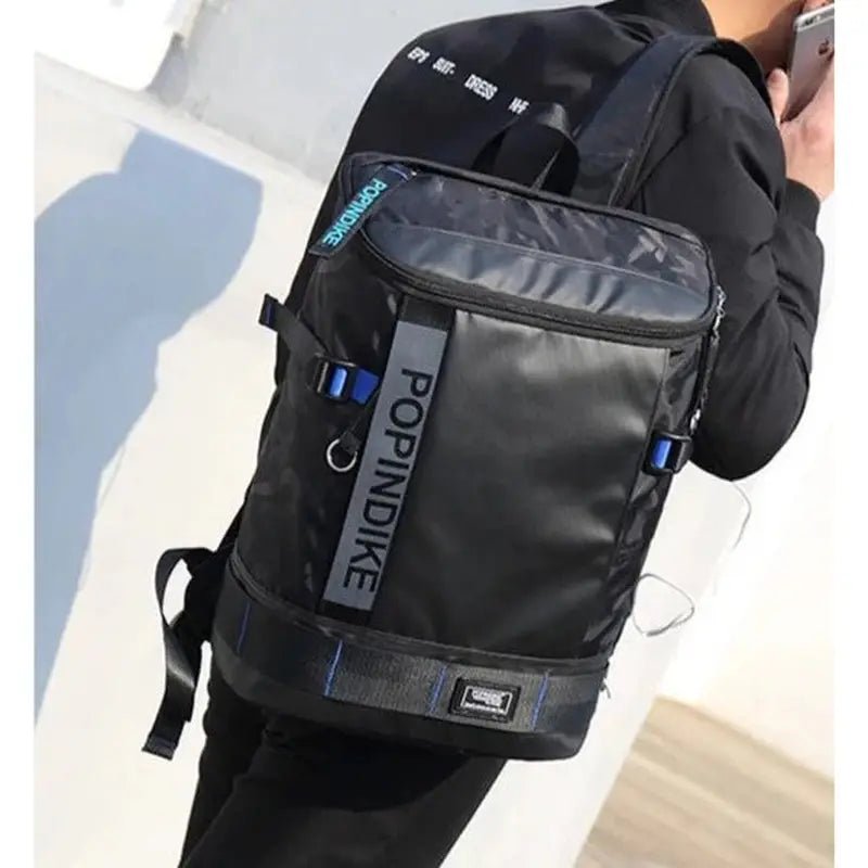 Sac à dos étanche homme noir avec accents bleus et multiples compartiments