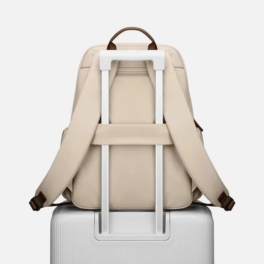 Sac à dos étudiant femme beige avec manchette de bagage et poignée en cuir marron