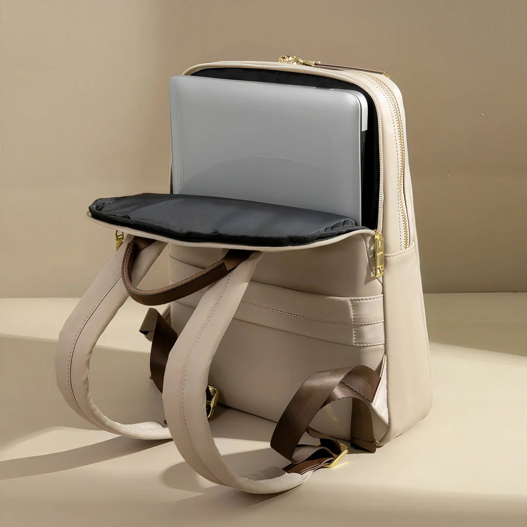 Sac à dos femme crème avec accents noirs et fermetures dorées pour PC 14 pouces Transit