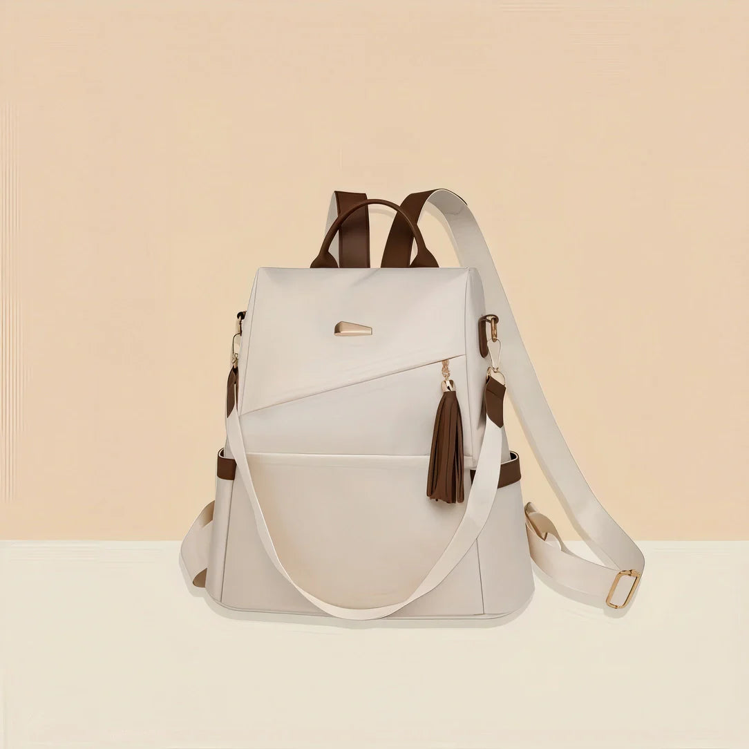 Sac à dos en cuir blanc avec accents marron et détail pompon Graine d’Or