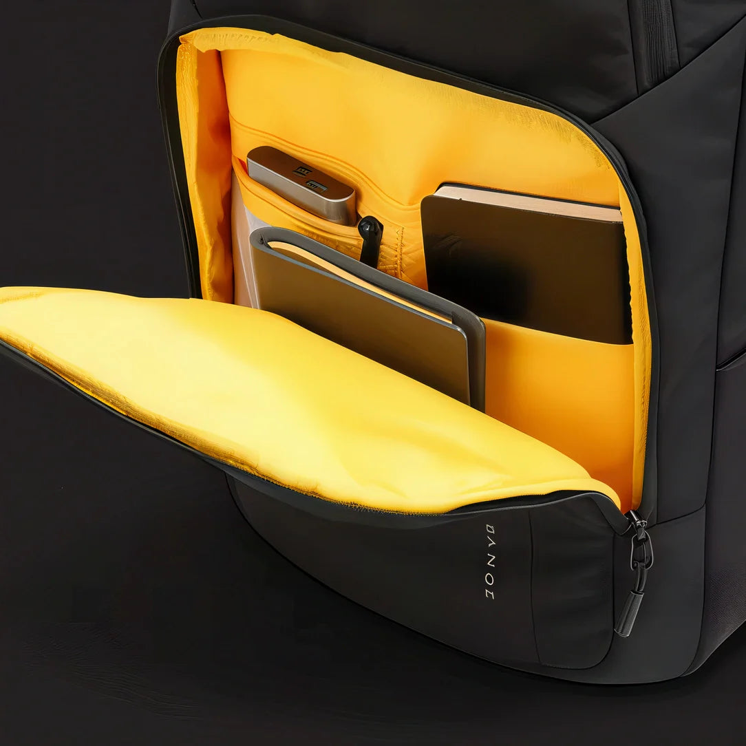 Sac à dos homme Dominus noir et jaune, compartiments rembourrés, résistant à l’eau